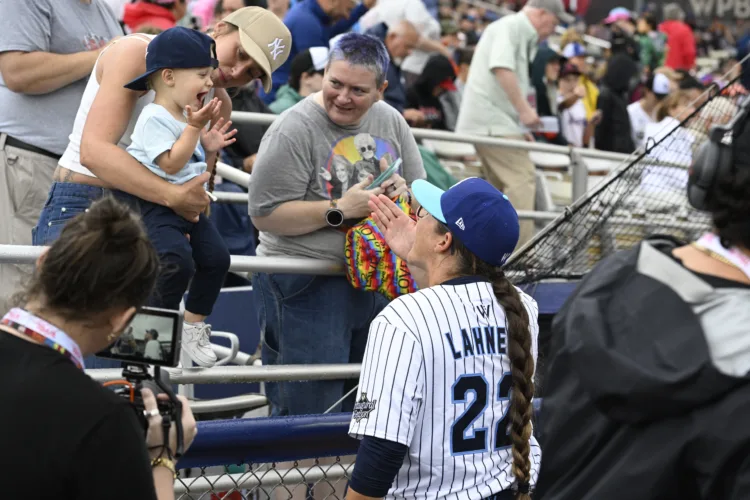 Women's Professional Baseball League makes a rainy debut in front of enthusiastic crowd